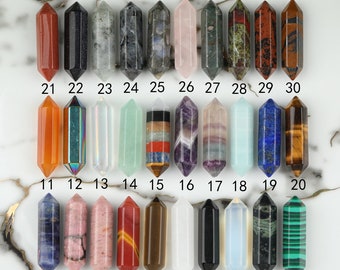 May include: Thirty double-terminated crystal points, each with a different color and pattern. The points are arranged in three rows of ten, numbered 1-30.