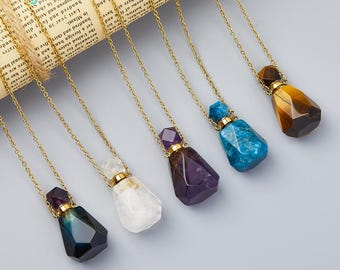 May include: Six gold chain necklaces with crystal bottle stoppers. The stoppers are in various colors, including amethyst, tiger's eye, clear quartz, and blue.