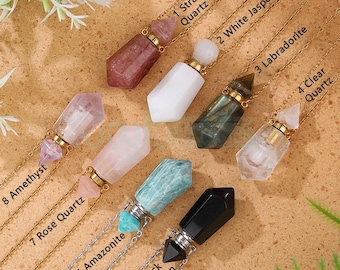 May include: Assortment of crystal pendant necklaces on gold chains. The crystals include Strawberry Quartz, White Jasper, Labradorite, Clear Quartz, Amethyst, Rose Quartz, Amazonite, and Black Obsidian. Each pendant is labeled with a number and crystal type.