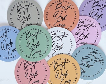 May include: Nine round stickers with a pastel color scheme. Each sticker has the text "Pioneer School 2023" and "Best Week Ever" written in black script.