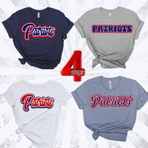 May include: Four different t-shirts with the word "Patriots" in various styles and colors. The shirts are navy blue, gray, white, and light blue.