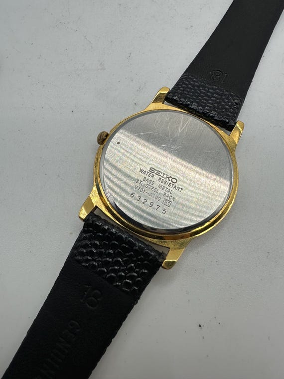 Seiko Vintage V701 Ladies Gold Tone Circle Watch White Face Roman