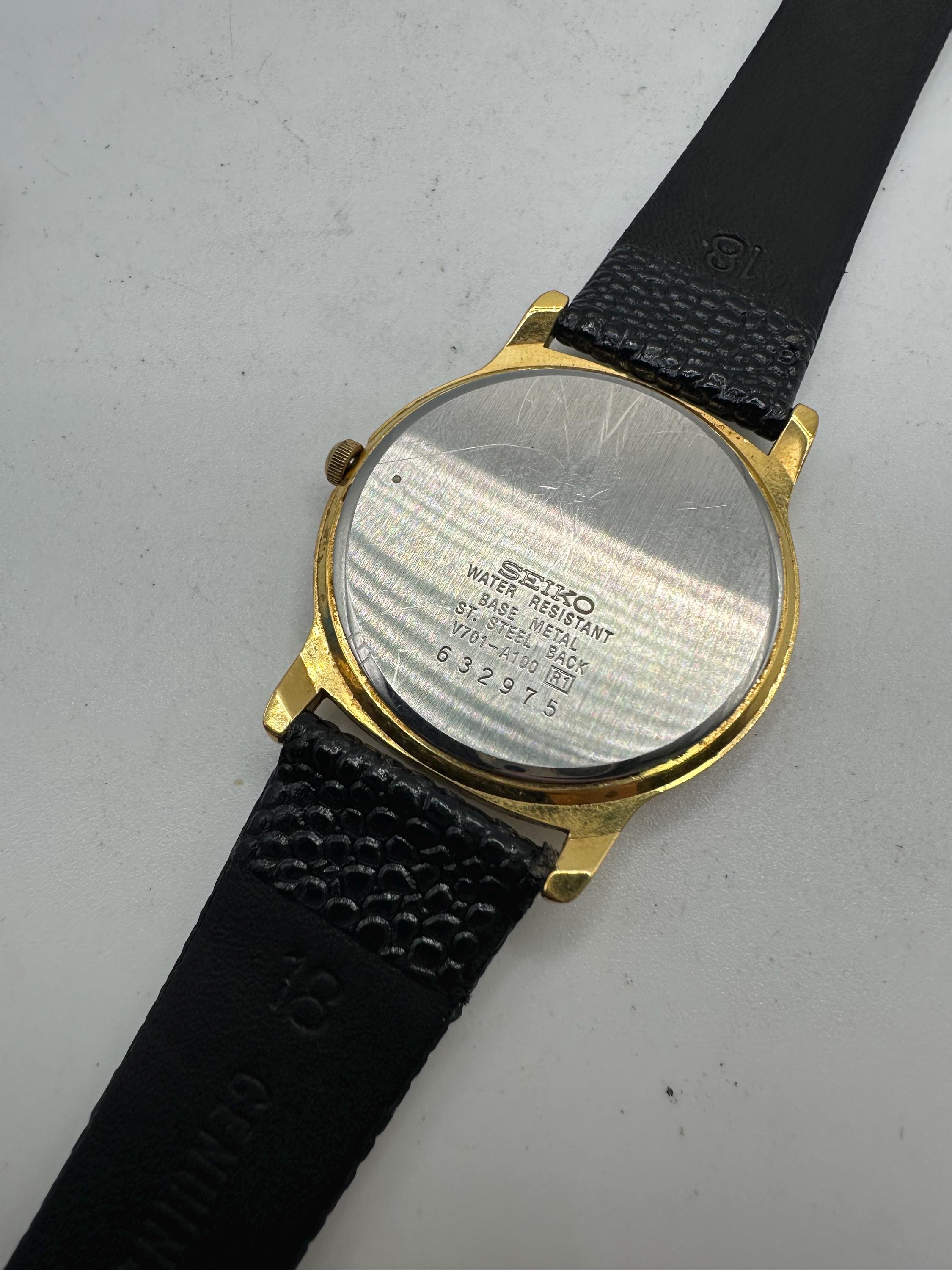 Seiko Vintage V701 Ladies Gold Tone Circle Watch White Face Roman