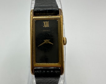 Vintage Seiko Quartz Japan 2E20 Base Metal St. Steel Back 2E20