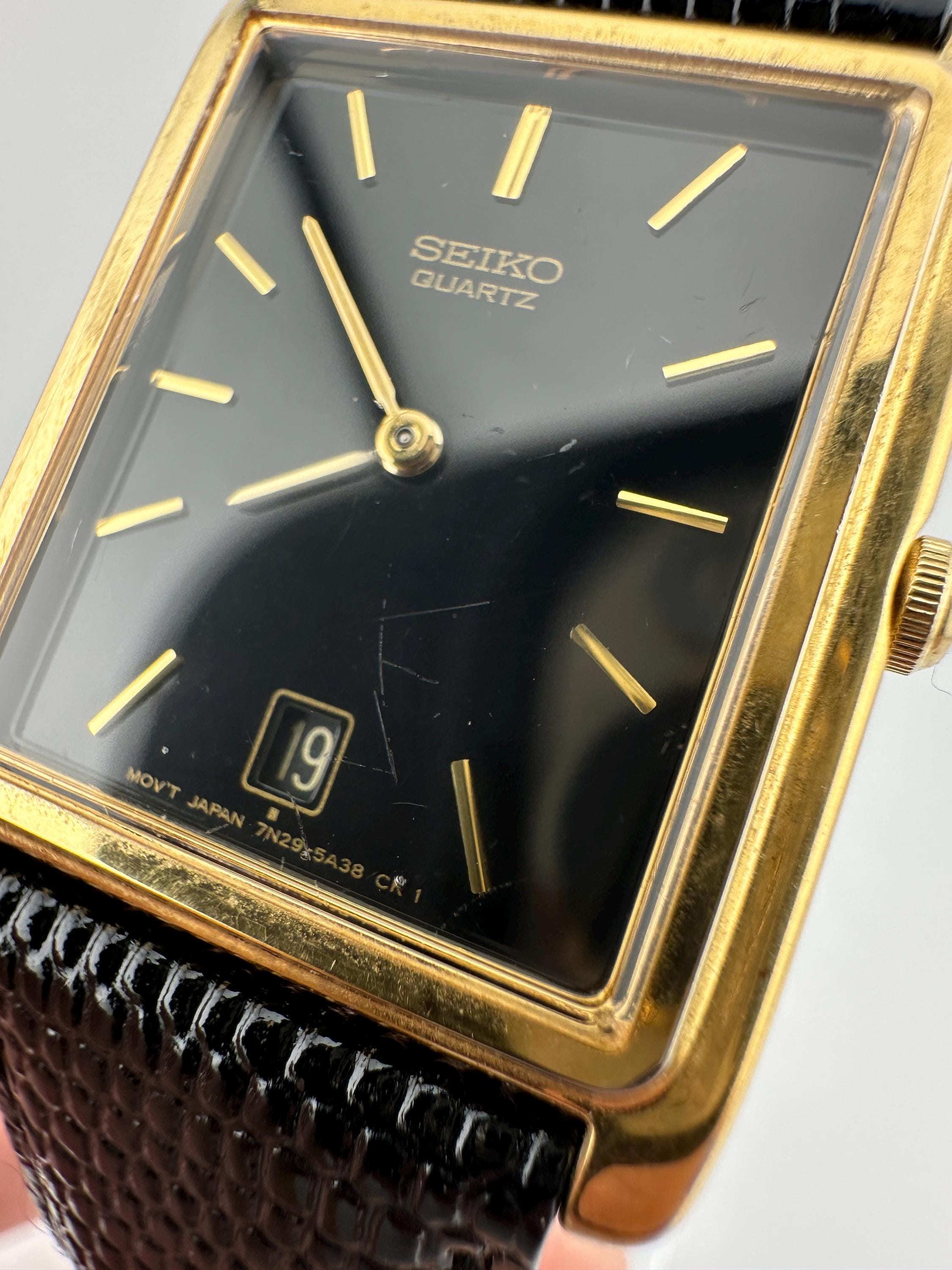 Vintage SEIKO tank watch 腕時計 スクエア y2k Seiko 7N29 Vintage Gold Tone Tank Watch Black Leather Strap