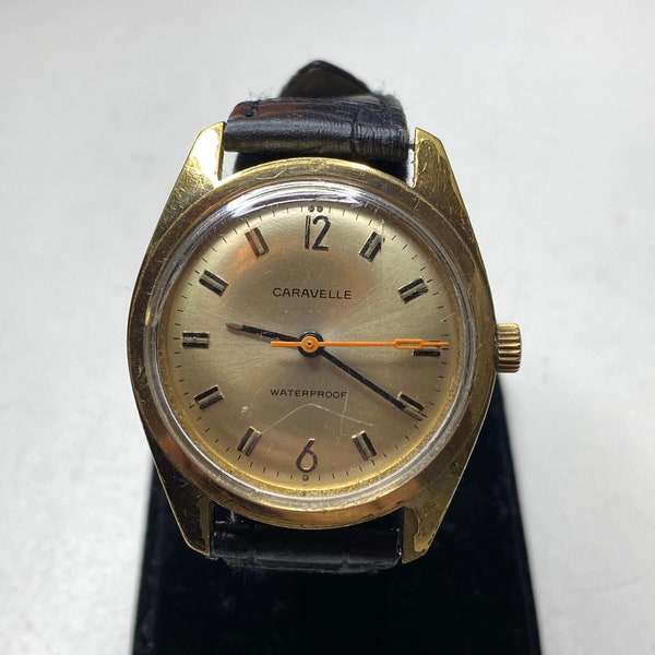 Vintage 36mm caravelle by Bulova mechanical wind gold tone watch N4 1974 leather strap retro gift him her men women manual