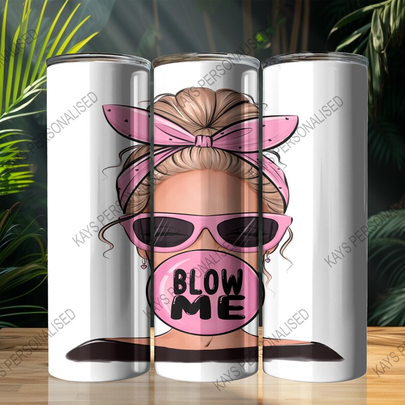 A 20oz Skinny Tumbler with an image of a cute messy bun lady head. there is a pink bandana wrapped around her hair and she has pink sunglasses with black lenses on. She is blowing a big pink bubble with the words "BLOW ME" written in black bubble lettering.