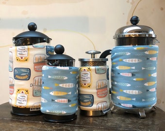 Insulating Cafetiere Cosy. Double sided FISHES design.  Machine washable. Velcro tab fastening. French press cover