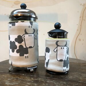 Insulating Cafetiere Cosy. Double sided COW/HEN design. Machine washable. Velcro tab fastening. French press cover. image 3