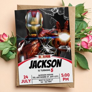 May include: A birthday invitation with an Iron Man theme, showing a red and gold Iron Man illustration against a broken glass effect. The invitation includes the name "Jackson", age "5", date, time, and RSVP details. The invitation is on a brown envelope.