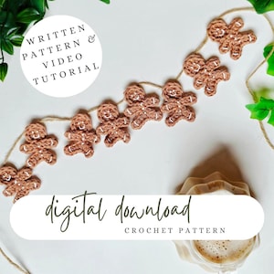 May include: A digital download crochet pattern for a gingerbread man garland. The pattern includes written instructions and a video tutorial. The image shows a garland of crocheted gingerbread men hanging on a white background.