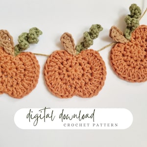 May include: A digital download crochet pattern for a garland of orange crocheted pumpkins with green crocheted leaves. The text "digital download crochet pattern" is on a white background.