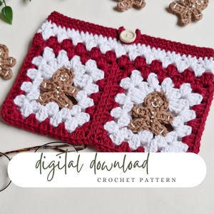 May include: A crochet pattern for a red and white gingerbread man themed zipper pouch. The pouch features two gingerbread men in the center and a button closure. The text "digital download crochet pattern" is at the bottom of the image.