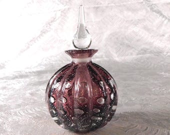 Frasco de perfume Bullicante morado con purpurina dorada # 27358