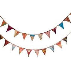May include: A colourful fabric bunting with triangular flags in various patterns and colours, strung on a natural twine. The bunting is perfect for adding a festive touch to any party or event.