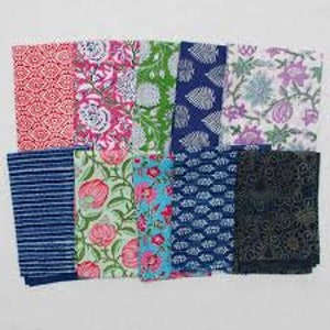 May include: Assortment of 12 fabric squares with various floral and geometric patterns in shades of blue, green, pink, and white. The fabric squares are approximately 10 inches by 10 inches.