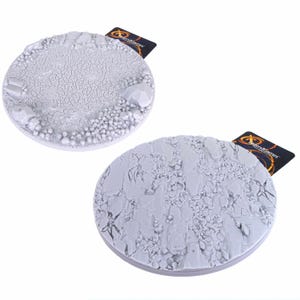 May include: Two circular light grey resin gaming bases featuring textured terrain surfaces. One base displays a cracked earth pattern with scattered rocks, while the other shows a jagged, rocky landscape. Each base includes a small LegendGames tag.