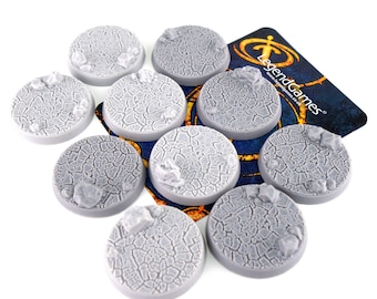 May include: Ten gray plastic round bases with a cracked, textured surface. The bases are designed for miniature wargaming figures.