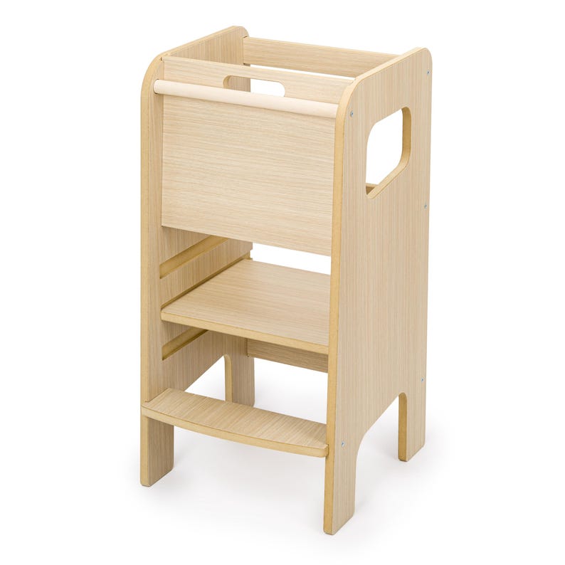 May include: A light-coloured wooden learning tower featuring a tall, enclosed frame with a horizontal safety bar at the top, a central platform, and a single lower step. The structure includes side cutouts for handles and a smooth, natural wood grain finish.