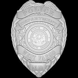 May include: A silver police badge with the words "Police Department" and "West Fargo, N.D."  The badge also features the state seal of North Dakota.