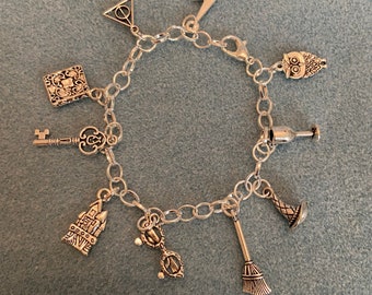 Wizard inspired Charm bracelet with owl,broomstick witches hat,key,castle & other charms silver plated with Tibetan silver charms