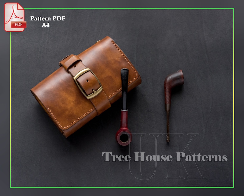 May include: A brown leather tobacco pouch with a brass buckle and stitching. The pouch is on a black surface with two wooden pipes.