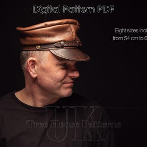 May include: A brown leather cap with a brim and a strap. The cap is on a person's head. The text "Digital Pattern PDF" is at the top of the image. The text "Eight sizes included from 54 cm to 61 cm" is at the top right of the image. The text "Tree House Patterns" is at the bottom of the image.