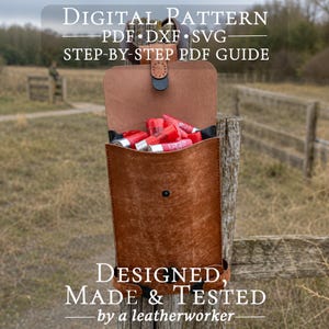 May include: A brown leather pouch with a flap closure, containing several red shotgun shells. The text reads: DIGITAL PATTERN PDF DXF SVG STEP-BY-STEP PDF GUIDE DESIGNED MADE & TESTED by a leatherworker.