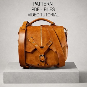 May include: A tan leather satchel with a top handle and adjustable shoulder strap. The bag has a flap closure with a buckle and decorative rivets. The text "PATTERN PDF - FILES VIDEO TUTORIAL" is visible on the image.