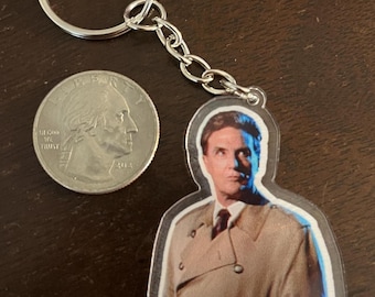 Your favorite host of The Unsolved Mysteries tv show on a keychain! Free Letter!