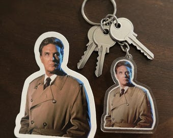 Gift Set! Robert Stack, your favorite host of The Unsolved Mysteries tv show on a keychain and a sticker! Free Letter!