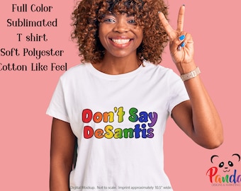 Don't Say Desantis in Rainbow Lettering Sublimated T-shirt - Soft Polyester Shirt. Ron's hateful Don't Say Gay law is anti LGBTQ