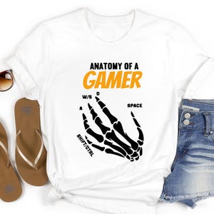 Skeleton Hands Design Shirt
Gamer Gift Idea
Gaming Enthusiast Shirt
Unisex Gamer Tee
High-Quality Gaming Shirt
Creative Gaming Shirt
Casual Gamer Shirt