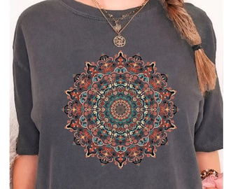 May include: A charcoal gray t-shirt with a colorful mandala design printed on the front. The mandala features intricate details in shades of red, orange, yellow, blue, and green.