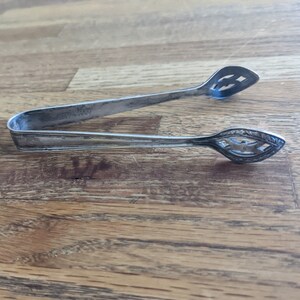 Silver Sugar Cube Tongs by International Silver Company for The Ambassador Hotel New York City Marked 1926