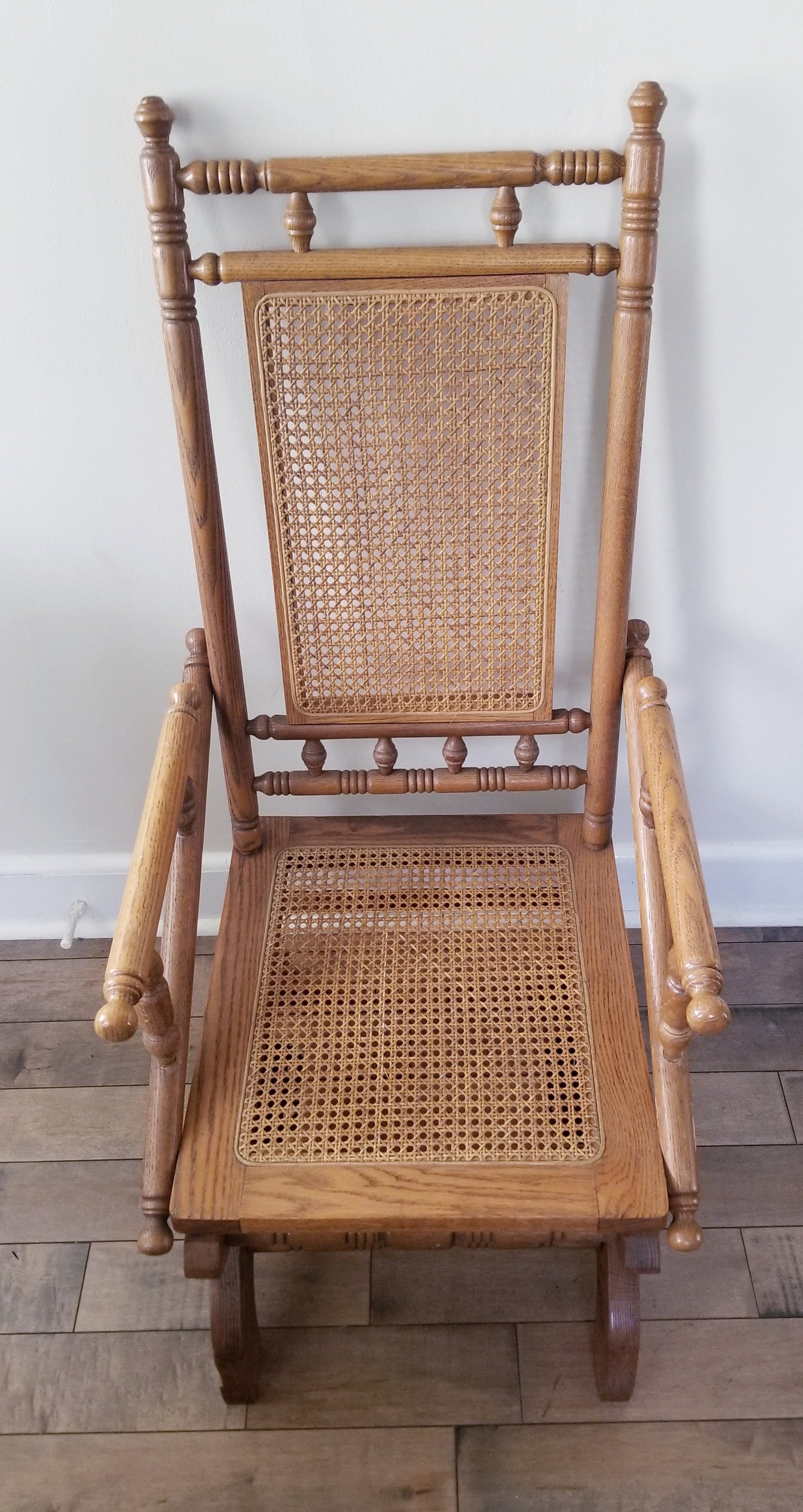 Antique Oak and Cane Rocking Chair, Elevated on Spring Rocker Mechanism
