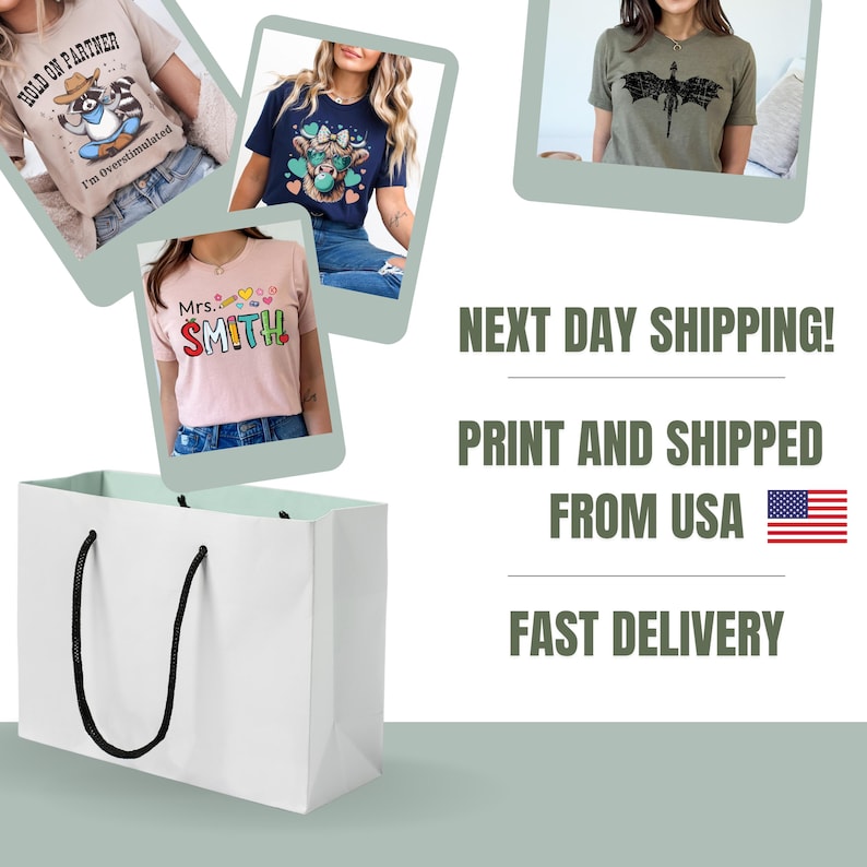 May include: A white shopping bag with black handles is in the foreground. Several t-shirts with graphic designs are displayed. The shirts have text and illustrations. Text on the shirts includes "HOLD ON PARTNER", "I'm Overstimulated", and "Mrs. SMITH".