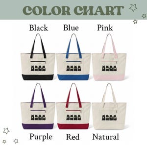 May include: Color chart featuring six canvas tote bags in various colors: black, blue, pink, purple, red, and natural. Each bag has a matching bottom and handles, with a small pocket and a black cat graphic.