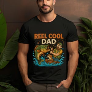 Reel Cool Dad Shirt, Fishing Lover Gift for Dad, Funny Fathers Day Graphic Tee for Fishermen, Cute Dog & Big Bass Cartoon Unisex T-Shirt