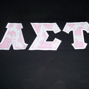 Alpha Sigma Tau Shirt -- Pink Cow Print on White Twill