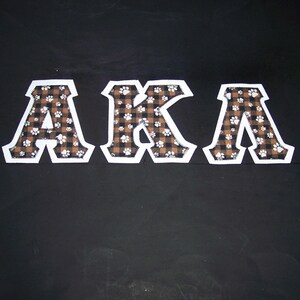 Alpha Kappa Lambda Shirt -- Paw Prints & Plaid on White Twill