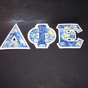 Delta Phi Epsilon Shirt -- Starry Night on White Twill