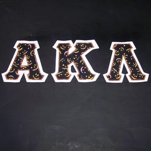 Alpha Kappa Lambda Shirt -- Jack O'Lantern Faces on White Twill
