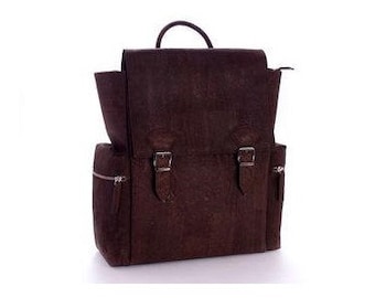 May include: A brown leather backpack with two buckle closures and side pockets.