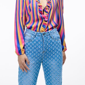 The Star Crossed Jeans | Your New Favorite Pants | Relaxed Fit Mid Wash Denim with a High Waist and Allover Cutout Detail | Goose Taffy