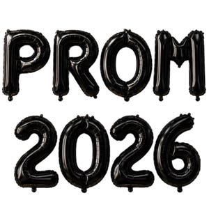 May include: Black foil balloons spelling out "PROM 2026". The balloons are arranged in two rows, with "PROM" on top and "2026" below. The balloons are inflated and have a shiny, reflective surface.