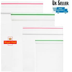 May include: Four clear plastic resealable bags with red and green stripes. The bags are different sizes and are stacked on top of each other.