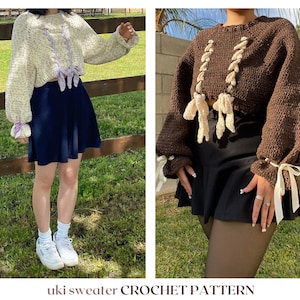 May include: Two cropped sweaters with a lace-up detail and ribbon ties. The sweater on the left is white with purple accents, and the sweater on the right is brown with cream accents.