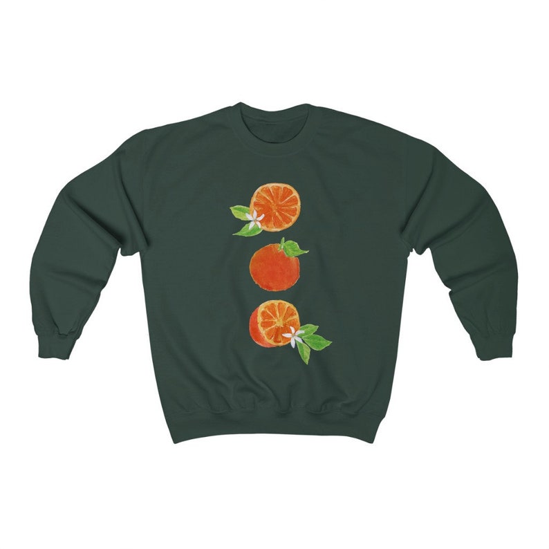 May include: A dark green sweatshirt with a graphic of three orange slices with white blossoms and green leaves.