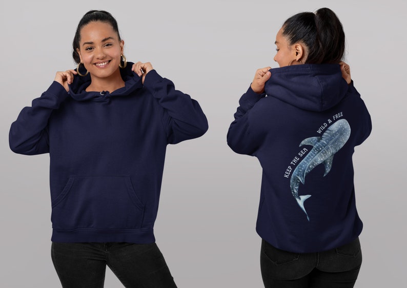 May include: A navy blue hoodie with a white whale shark graphic on the back. The graphic includes the text "Keep the sea wild & free".